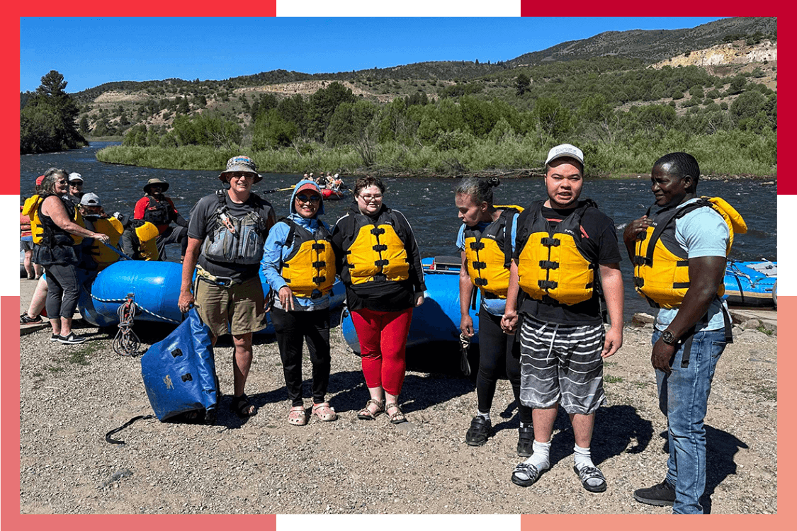 A group of Wheat Ridge Regional Center residents and staff wear life jackets during a rafting trip