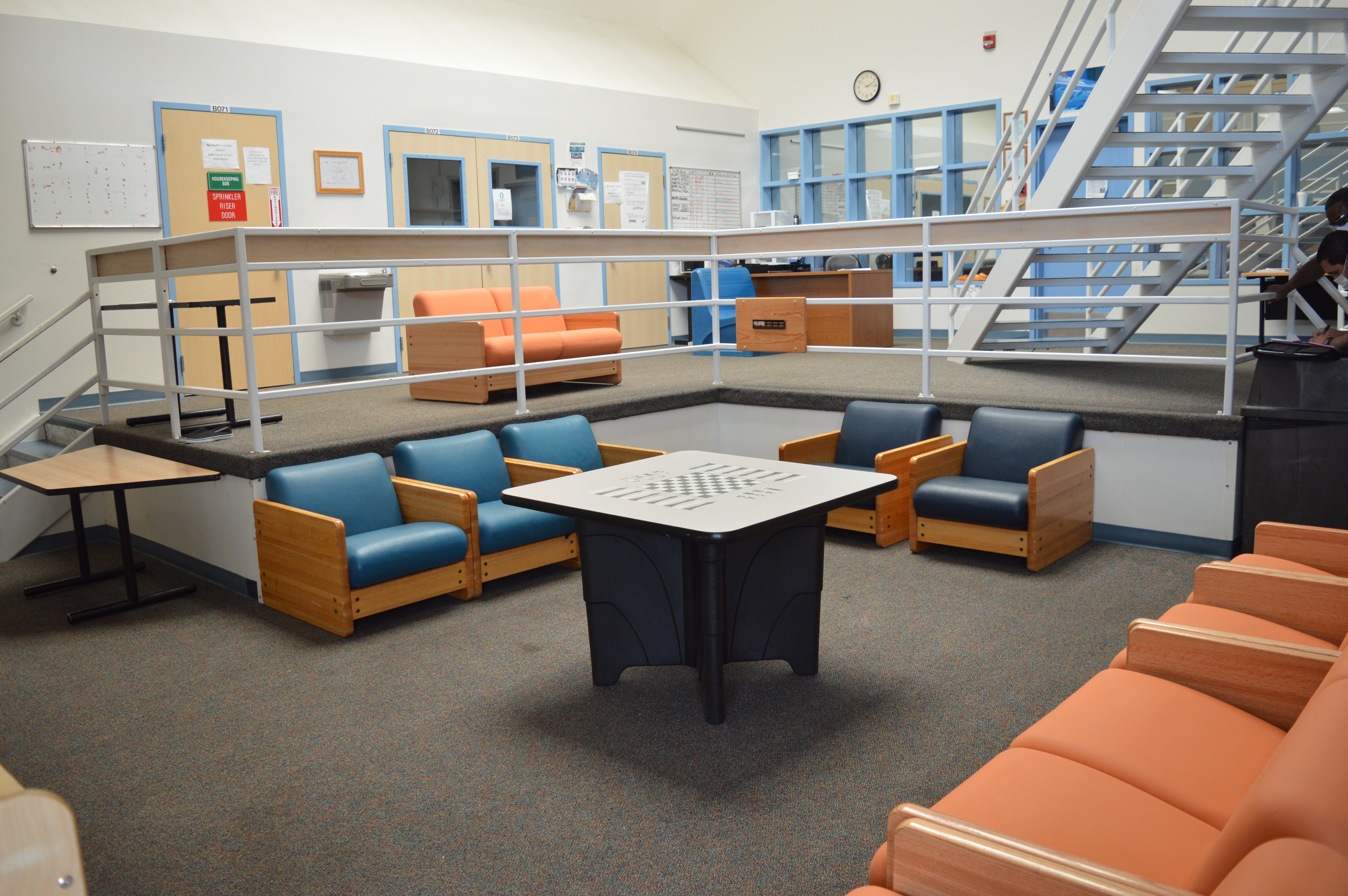 Youth pod with tables and couches at Zebulon Pike Youth Services Center