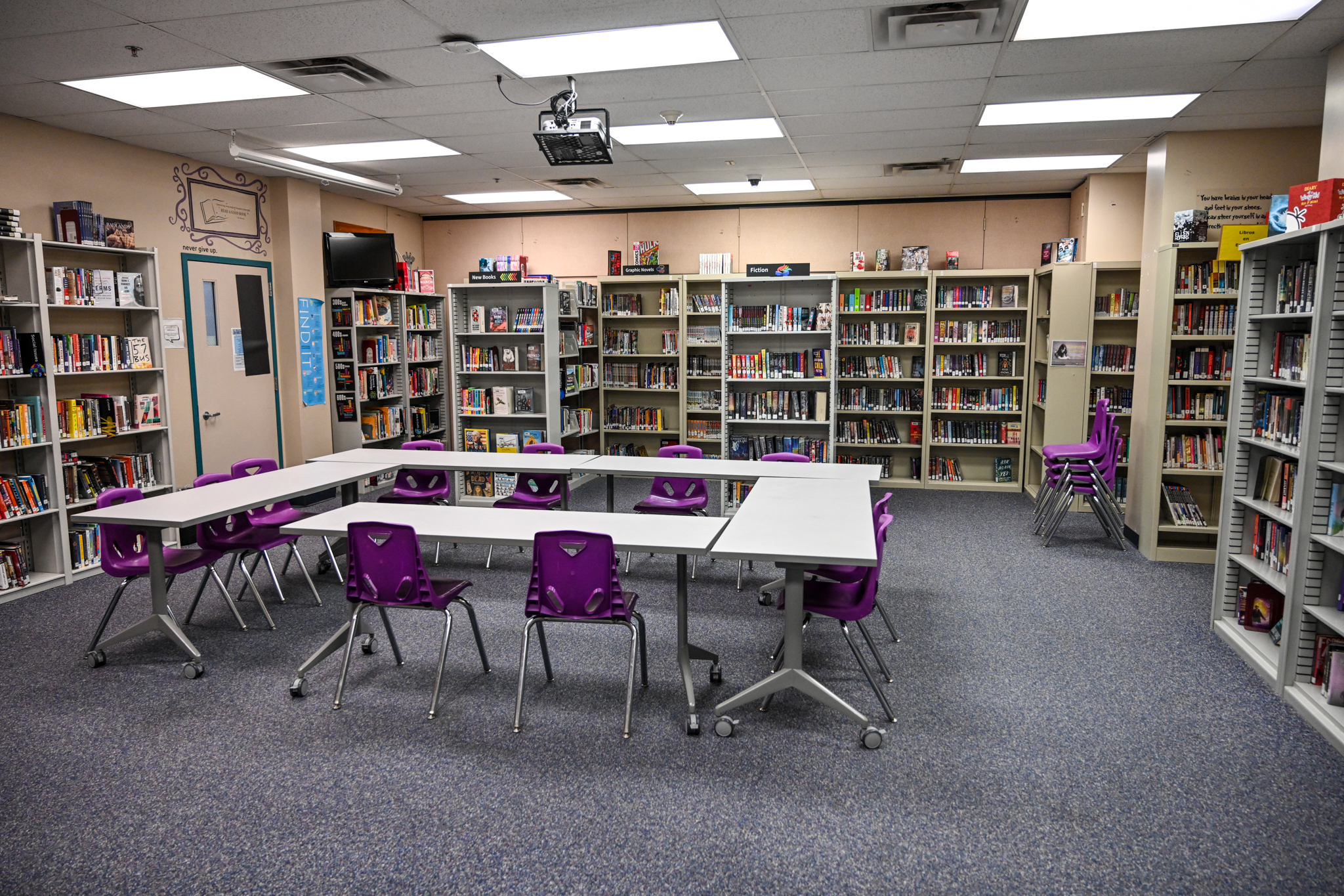 Library with tables and bookshelves at Platte Valley Youth Services Center