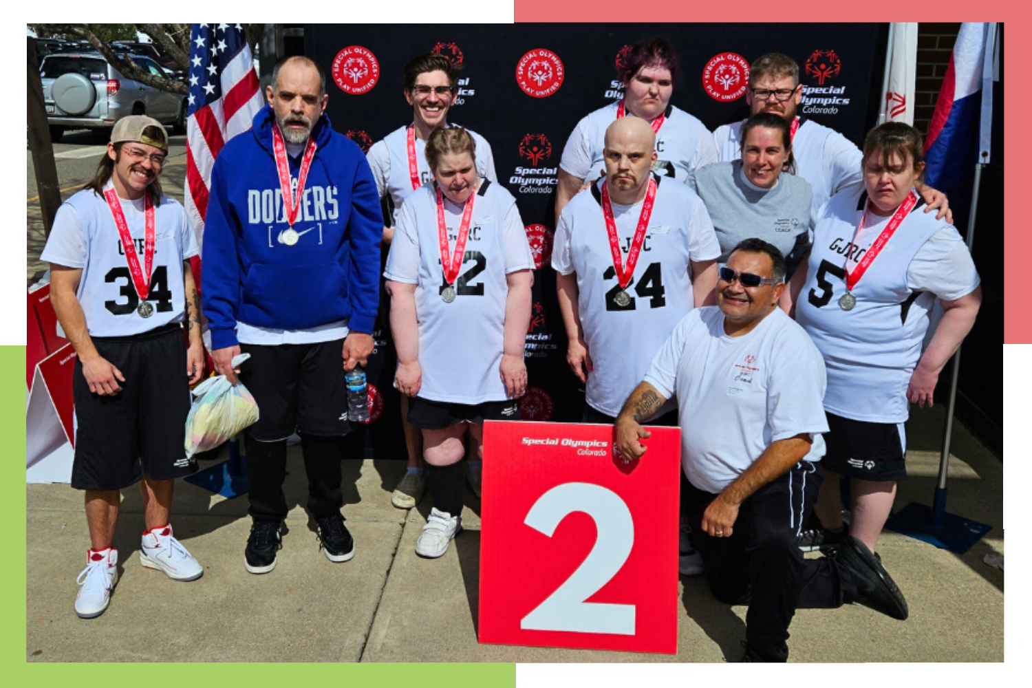 Residents and staff of Grand Junction Regional Center pose for a photo with medals after winning second place in the Colorado Special Olympics basketball tournament