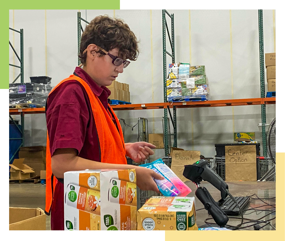 A female Regional Center resident scans a barcode on a packaged food item