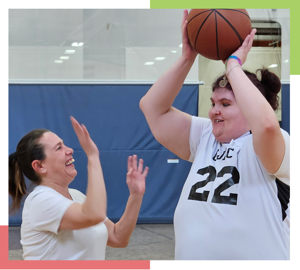 Two women playing basketball