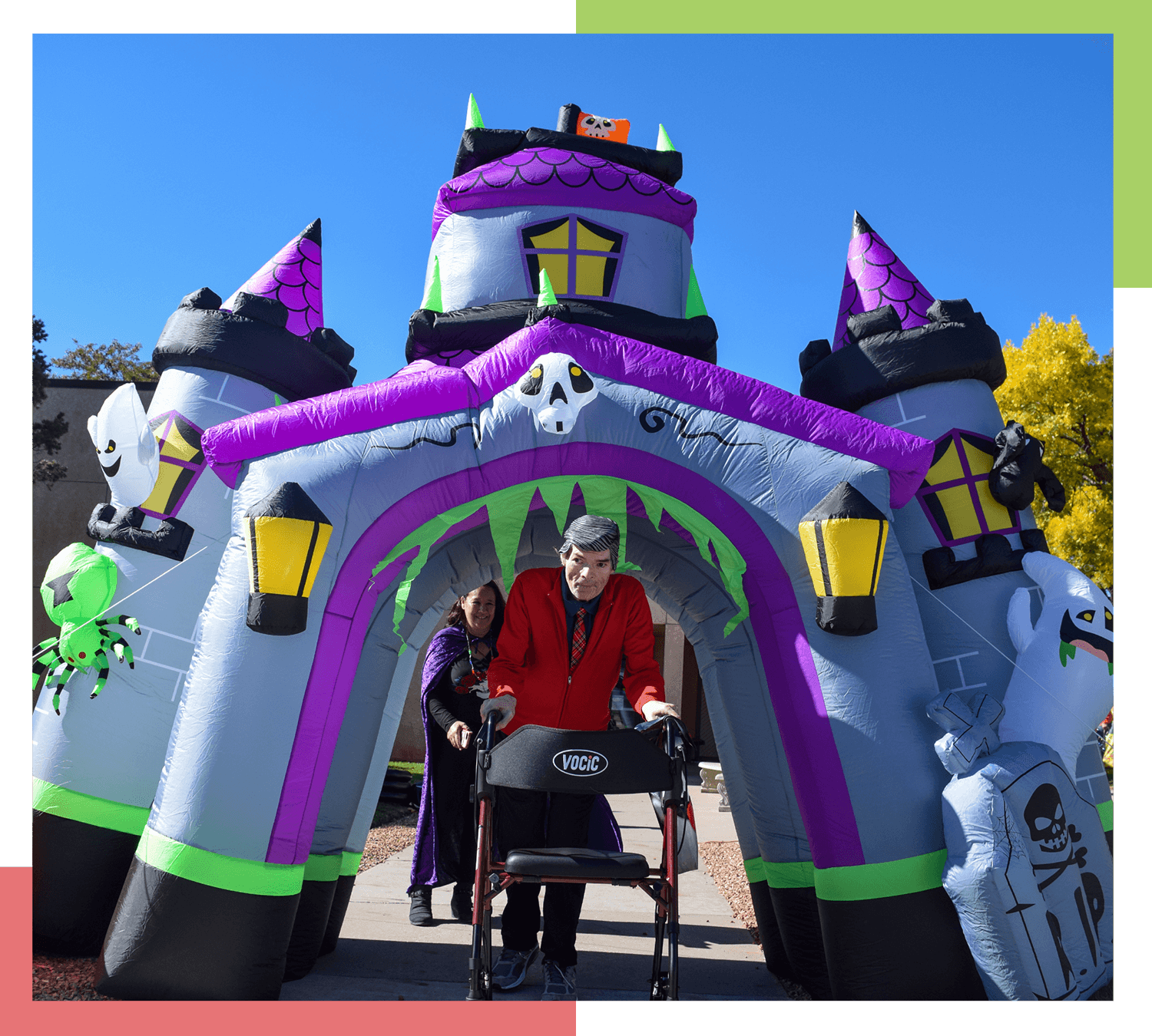 A male resident of Pueblo Regional Center walks under a haunted house inflatable 