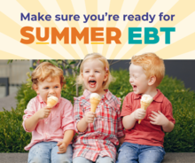 Three children sitting together and happily eating ice cream