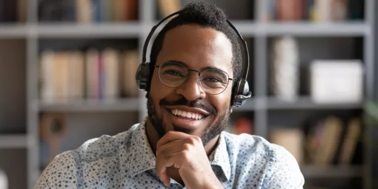 Smiling man with telephone headset